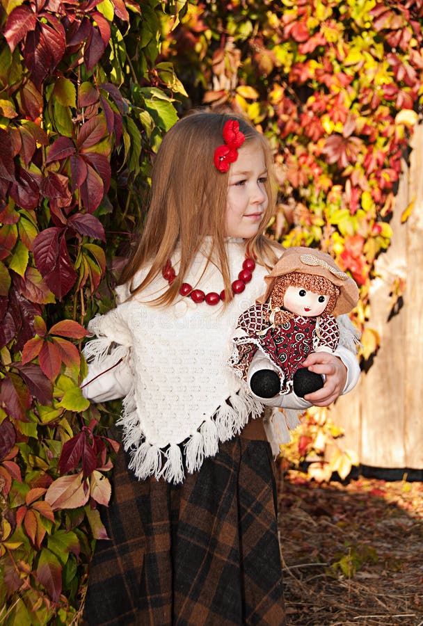 Beautiful Little Girl with Doll Stock Photo Image of nature