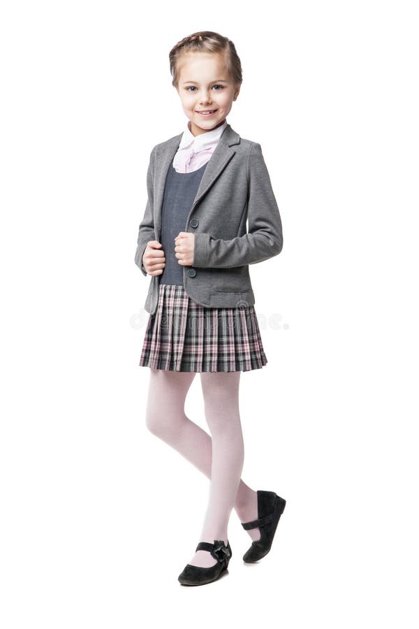 Beautiful little girl in school uniform isolated stock image Beautiful little girl in school uniform isolated stock image