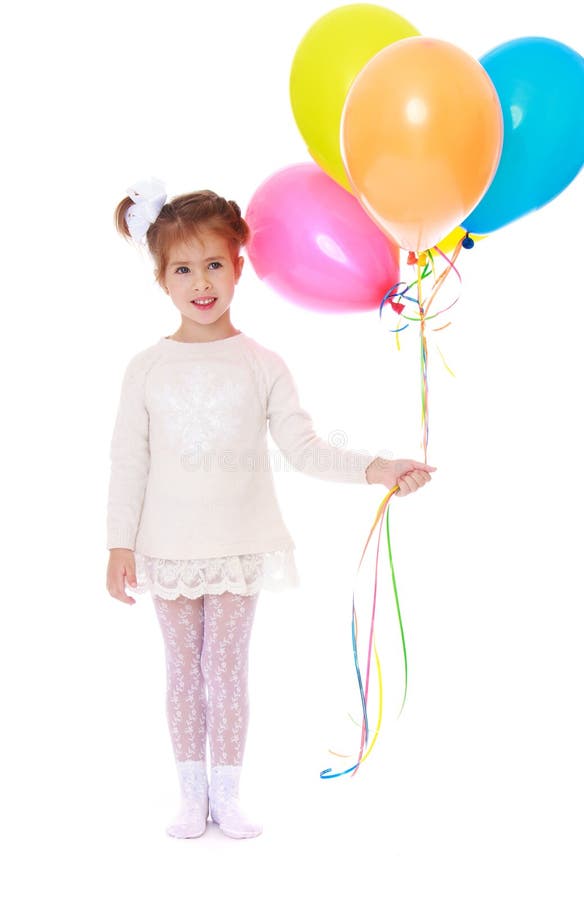 Beautiful little girl in a white dress