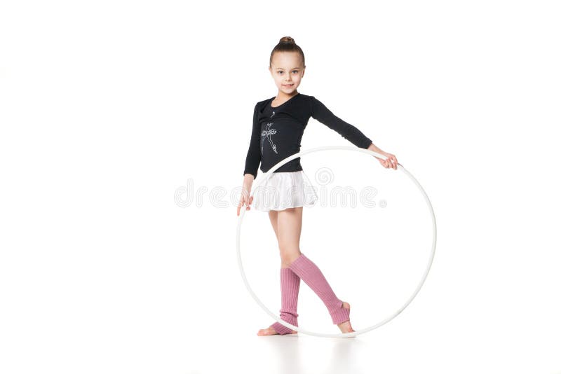 Beautiful little gymnast with the hoop