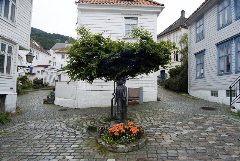 Beautiful little street with traditional Norwegian white houses in Bergen, Norway