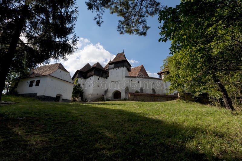 The beautiful little village of Viscri and the castle in the heart of rural Romania countryside in Transylvania on the top of the. Carpathian`s mountains royalty free stock photos The beautiful little village of Viscri and the castle in the heart of rural Romania countryside in Transylvania on the top of the. Carpathian`s mountains royalty free stock photos