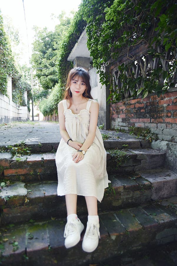 Beautiful and lovely Asian girl shows her youth in the park stock image Beautiful and lovely Asian girl shows her youth in the park stock image