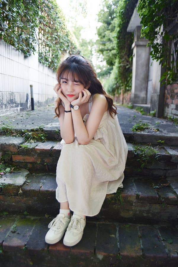 Beautiful and lovely Asian girl shows her youth in the park stock photo Beautiful and lovely Asian girl shows her youth in the park stock photo