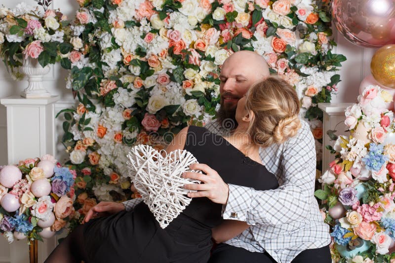 Beautiful loving couple kissing and has fun, a guy holding his beloved beautiful girl in his arms royalty free stock photo Beautiful loving couple kissing and has fun, a guy holding his beloved beautiful girl in his arms royalty free stock photo
