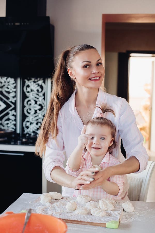 Beautiful Loving Mother And Pretty Daughter Cooking Together In The Kitchen Stock Image Image 