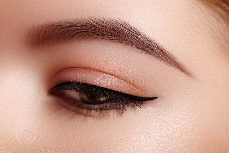 Beautiful Macro of Female Eye with Fashion Black Eyeliner Makeup. Perfect Graphic  Liner Shape. Cosmetics and Make-up Stock Image - Image of minimalism,  female: 178386911