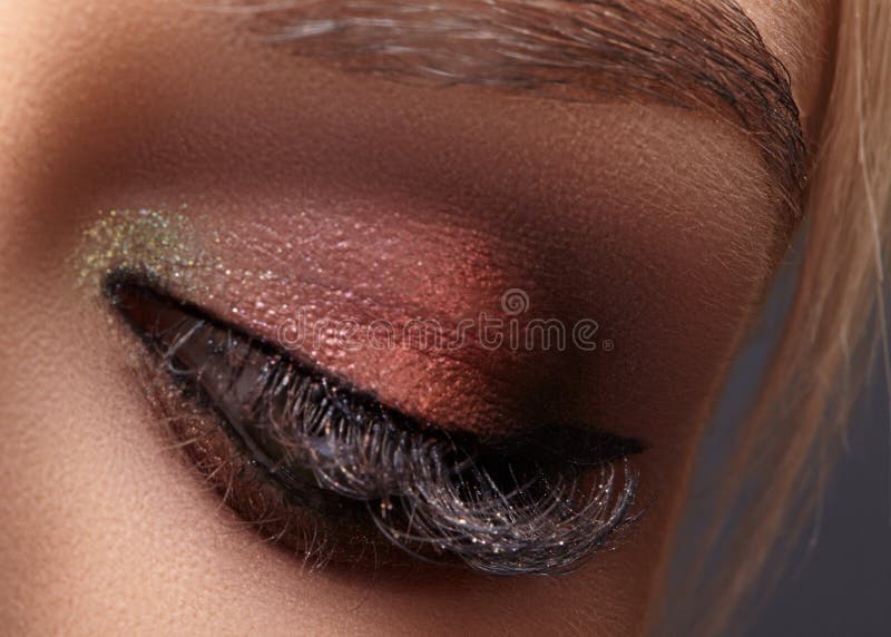 Beautiful female eye with extreme long eyelashes, black liner makeup. Perfect make-up, long lashes. Closeup fashion eyes stock photography Beautiful female eye with extreme long eyelashes, black liner makeup. Perfect make-up, long lashes. Closeup fashion eyes stock photography