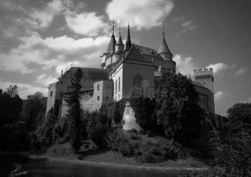 Beautiful magical romantic Bojnice castle with a park with an interesting garden and flowers in the background