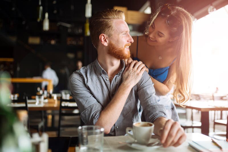 Beautiful man and woman flirt