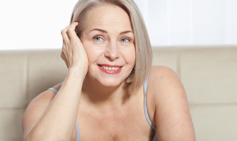 Active Beautiful Middleaged Woman Smiling Friendly And Looking Into The  Camera Woman39s Face Close Up Stock Photo - Download Image Now - iStock