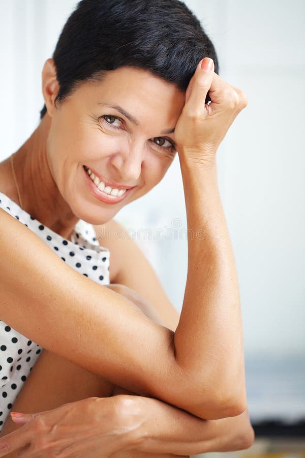 Beautiful Middle Aged Woman Takes A Selfie Outdoors On A Lakeside