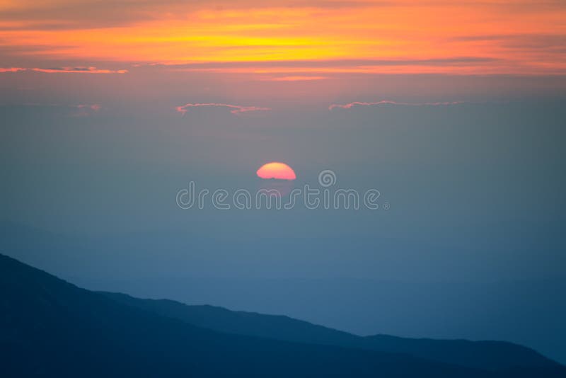 A beautiful minimalist mountain sunset scenery. Mountain landscape during the sunset in natural colors.