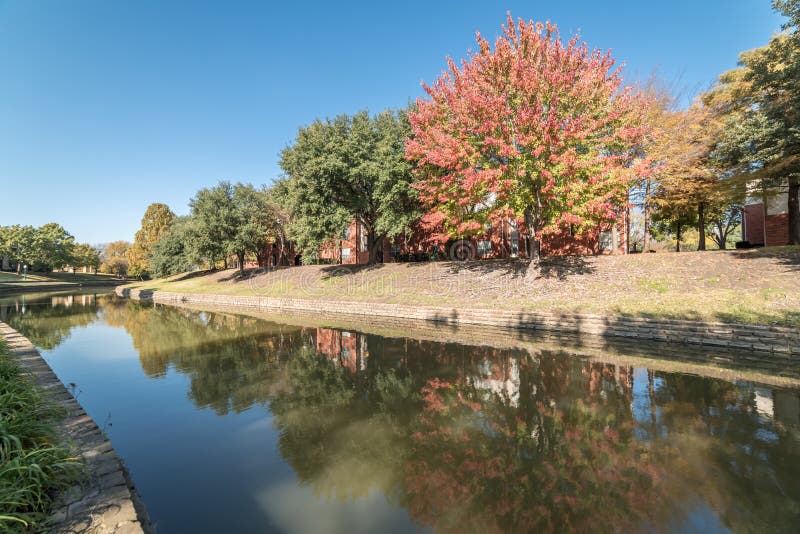Typical Multistory Riverside Apartment Complex with Fall Foliage in