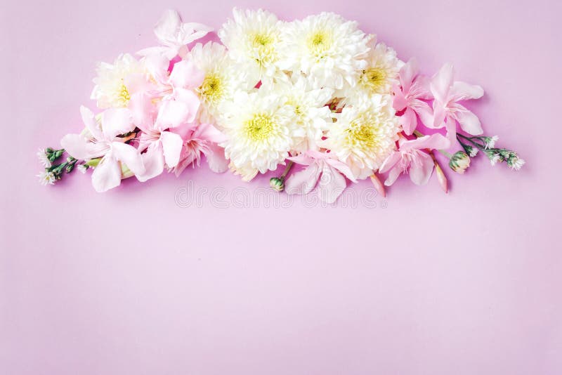 Beautiful mix flowers frame on soft pink romance background