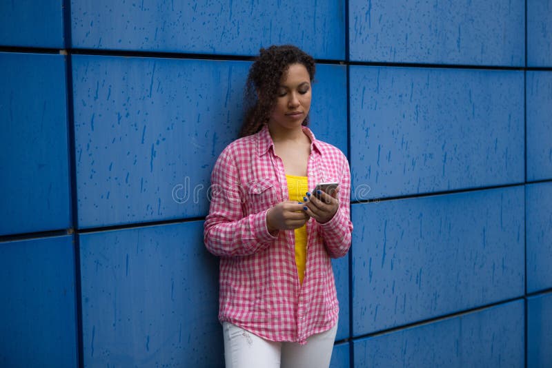 Beautiful mixed race African American teen girl woman young woman looking sad depressed stock photo Beautiful mixed race African American teen girl woman young woman looking sad depressed stock photo
