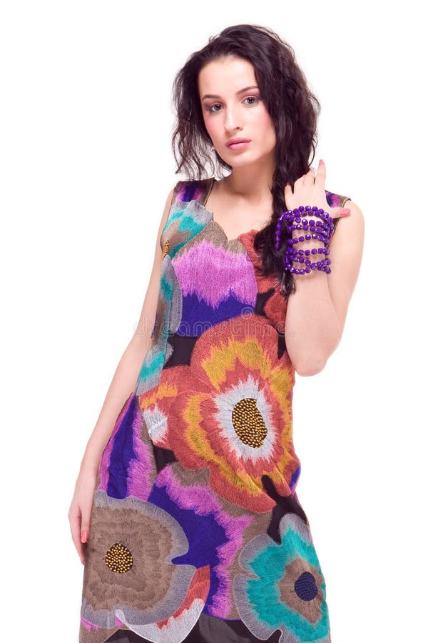 Beautiful model in colorful dress on white