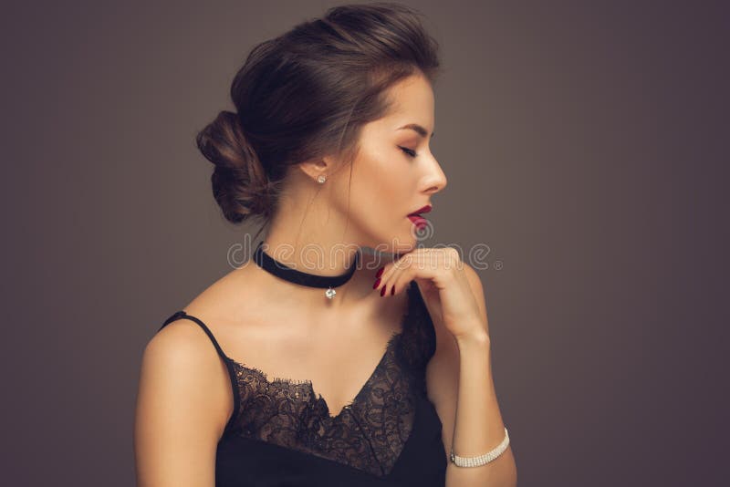 Beautiful model girl with elegant hairstyle . Woman with red lips and nails . Cosmetics, beauty and manicure on nails. stock photo Beautiful model girl with elegant hairstyle . Woman with red lips and nails . Cosmetics, beauty and manicure on nails. stock photo