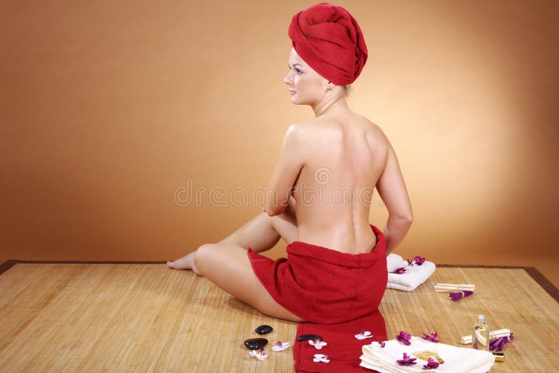 Beautiful model at wellness massage with hot stone stock photos Beautiful model at wellness massage with hot stone stock photos