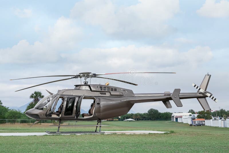 Beautiful Modern Helicopter on Helipad in Field Stock Photo Image of
