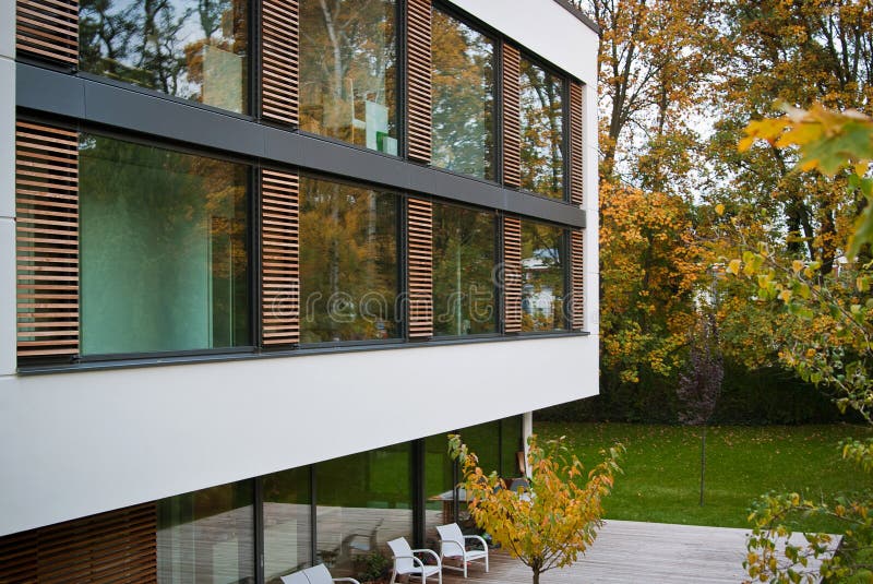 Beautiful modern residential building with huge glass windows.