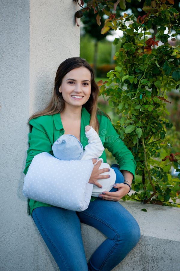 Beautiful mother and her baby in the park