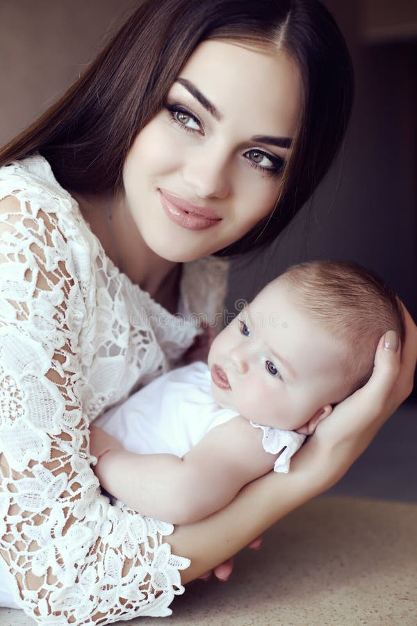 Beautiful Mother With Luxurious Dark Hair And Her Little ...