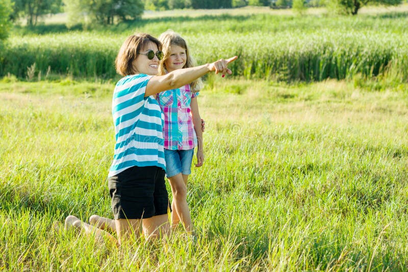 Beautiful mother outdoors with happy daughter child. royalty free stock photo Beautiful mother outdoors with happy daughter child. royalty free stock photo