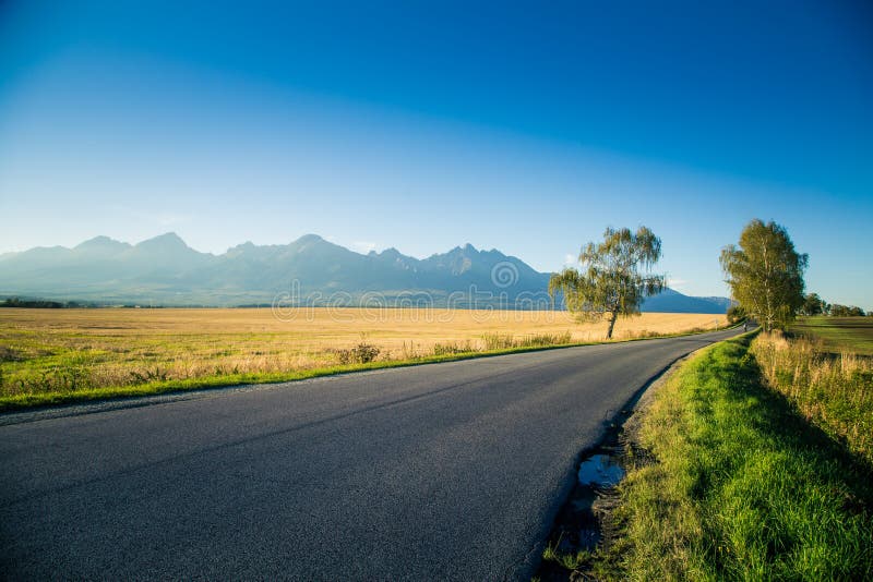 A beautiful mountain landscape with a road