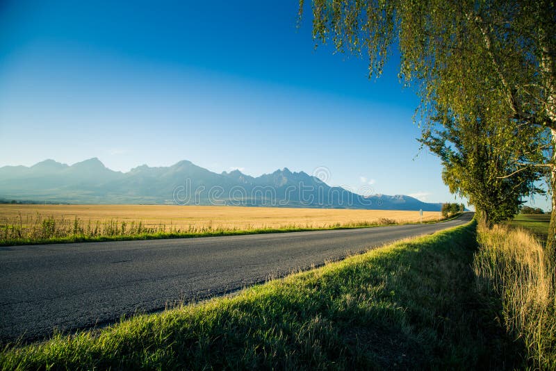 A beautiful mountain landscape with a road