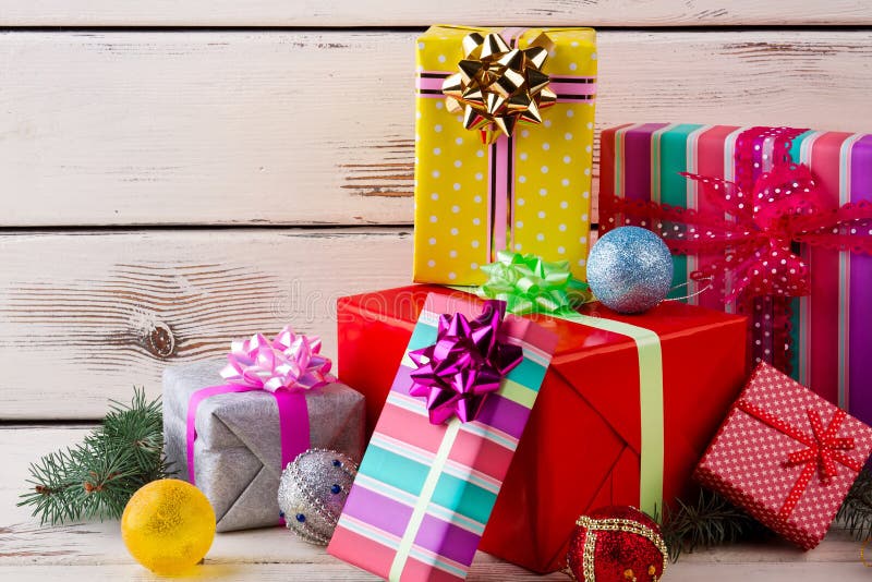 Beautiful multi-colored boxes with gifts. Christmas gifts, balls, tree. New Year composition royalty free stock images Beautiful multi-colored boxes with gifts. Christmas gifts, balls, tree. New Year composition royalty free stock images