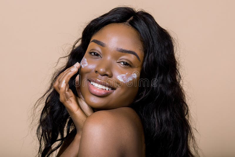 Beautiful Black Women Stars Nude - Beautiful Naked Black African Model with Flawless Skin and Long Hair,  Applying Moisturiser Face Cream on Her Cheeks Stock Photo - Image of beauty,  hair: 205656804