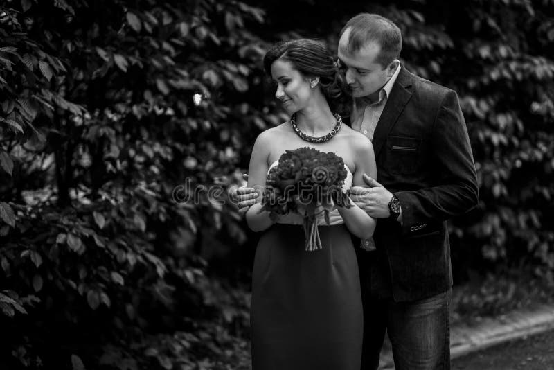 Beautiful Newlywed Couple Portait Gorgeous Brunette Bride With Red Flowers Bouquet Hugging With 