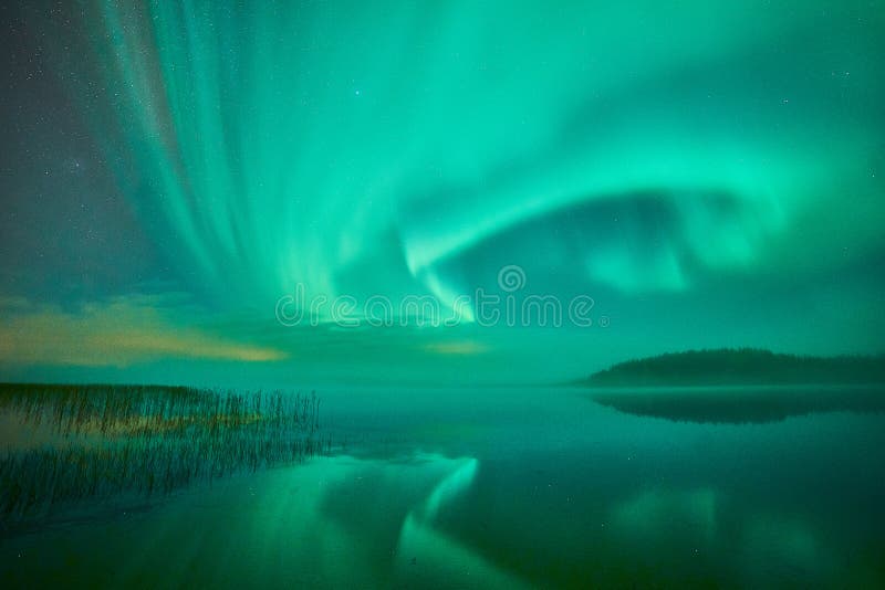 Reflections of northern lights in Swedish lake