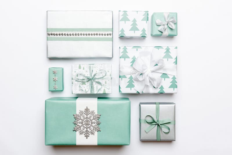 Beautiful nordic christmas gifts isolated on white background. Turquoise colored wrapped xmas boxes. Gift wrapping. royalty free stock photography Beautiful nordic christmas gifts isolated on white background. Turquoise colored wrapped xmas boxes. Gift wrapping. royalty free stock photography