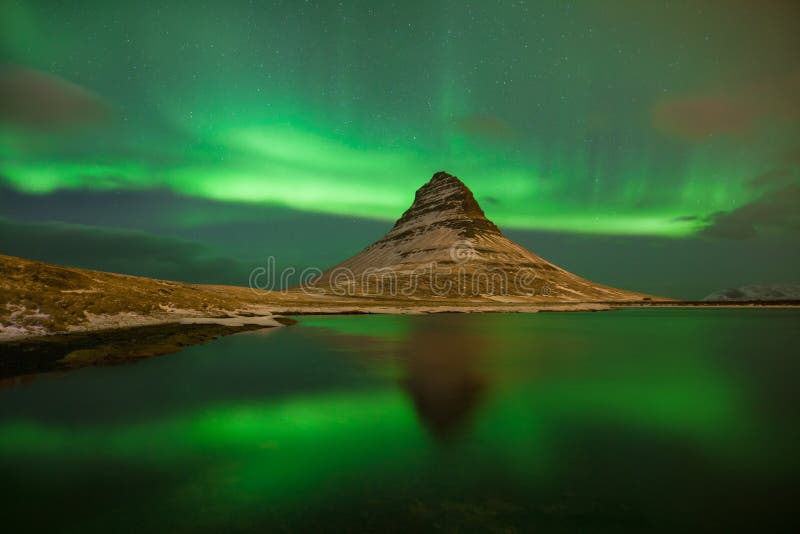 This beautiful northern lights or aurora borealis in Iceland was taken at or around Kirkjufell mountain near Grundarfjordur.