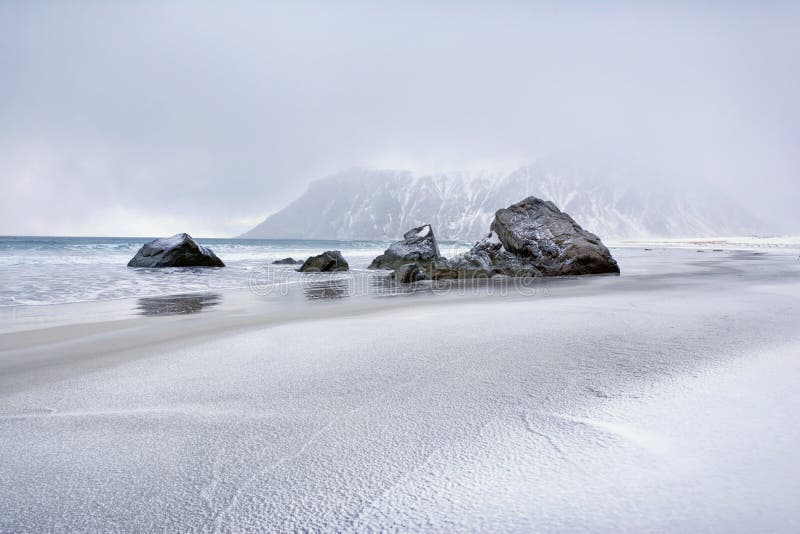 Beautiful Norway landscape of picturesque stones on the arctic beach of cold Norwegian Sea stock photo Beautiful Norway landscape of picturesque stones on the arctic beach of cold Norwegian Sea stock photo