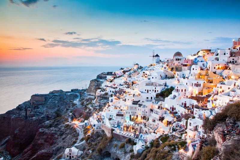 impressive evening view of Santorini island. Picturesque spring sunset on the famous Greek resort Oia, Greece, Europe. Traveling