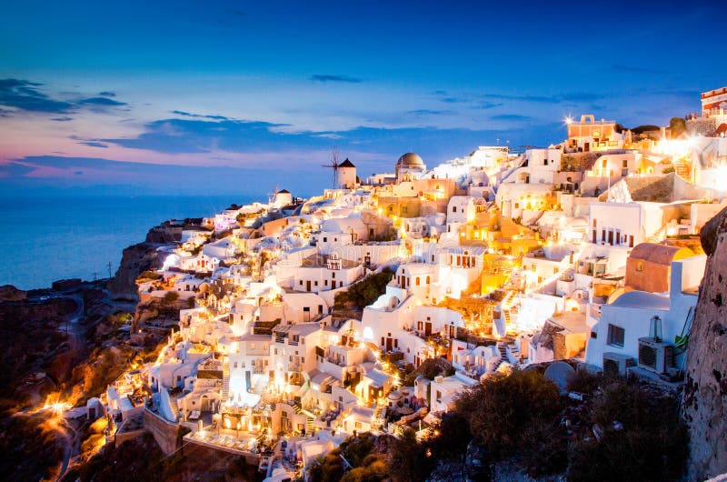 impressive evening view of Santorini island. Picturesque spring sunset on the famous Greek resort Oia, Greece, Europe. Traveling