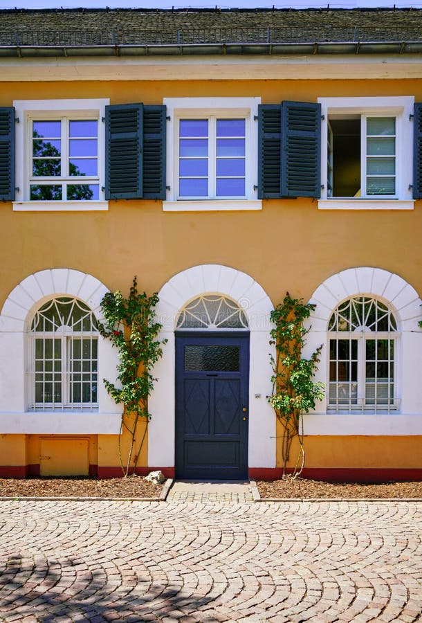 Beautiful Outbuilding Entrance Facade at Schloss Johannisberg Winery Estate in the German Rheingau Region. Famous for first Riesling Wine Production. Beautiful Outbuilding Entrance Facade at Schloss Johannisberg Winery Estate in the German Rheingau Region. Famous for first Riesling Wine Production.