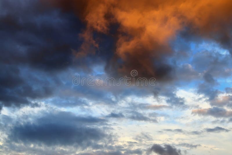 Beautiful panorama of orange and yellow clouds at sunrise/sunset on a blue sky in high resolution royalty free stock image Beautiful panorama of orange and yellow clouds at sunrise/sunset on a blue sky in high resolution royalty free stock image