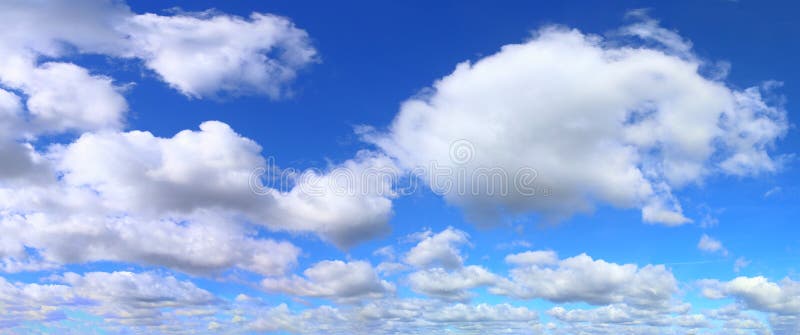 Beautiful panorama of orange and yellow cloudscapes at sunrise/sunset on a blue sky in high resolution royalty free stock photo Beautiful panorama of orange and yellow cloudscapes at sunrise/sunset on a blue sky in high resolution royalty free stock photo