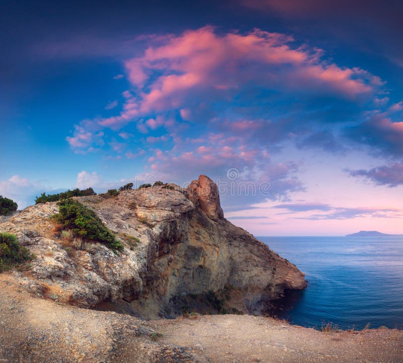 Beautiful panoramic landscape with mountains, sea at sunset