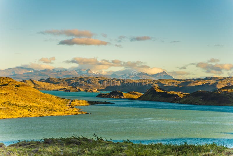 Beautiful Panoramic View Of Blue Water Lake With Golden Yellow Grass