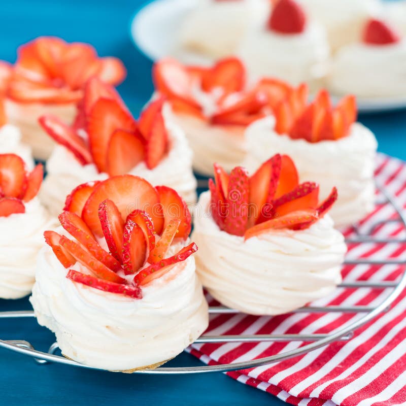 Beautiful Pavlova Cakes With Strawberries On A Blue Background Selective Focus Tasty Sweet