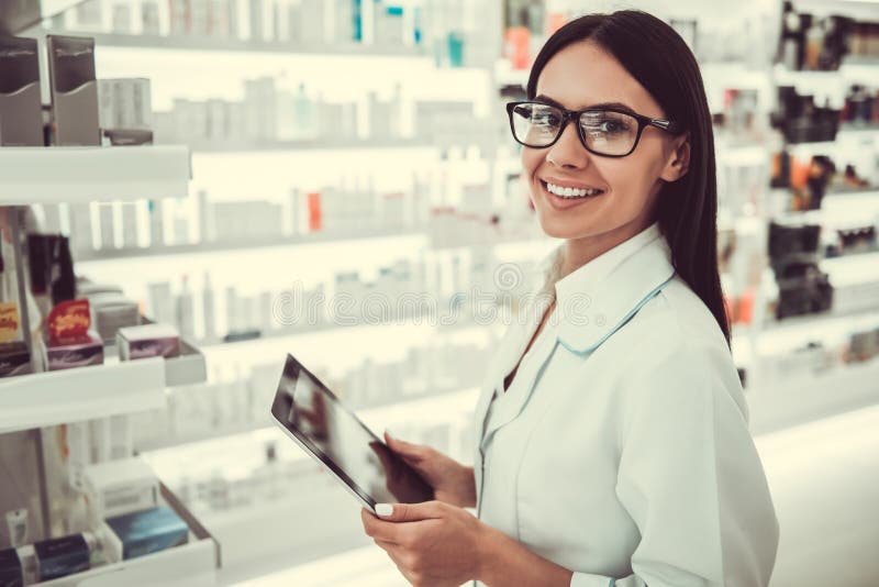 Beautiful pharmacist working royalty free stock images Beautiful pharmacist working royalty free stock images