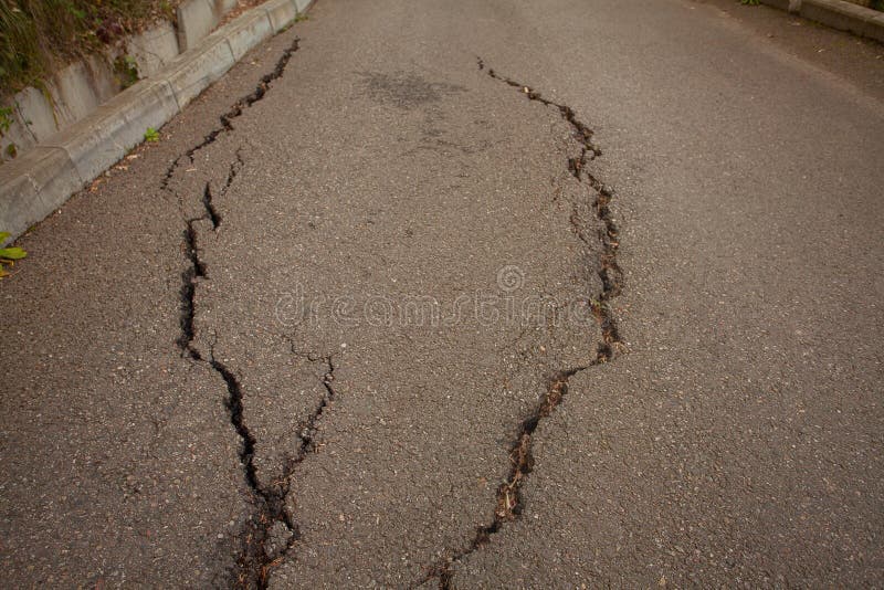 Photo of gray cracked asphalt pavement royalty free stock photography Photo of gray cracked asphalt pavement royalty free stock photography