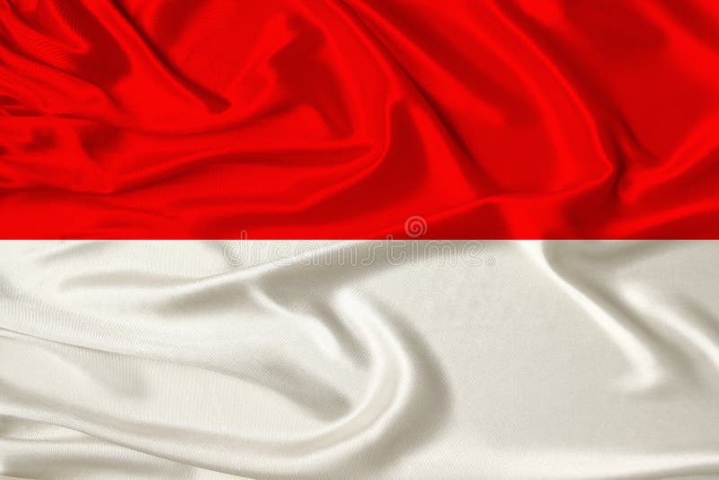 Beautiful photo of the national flag of Monaco and Indonesia on delicate shiny silk with soft draperies, the concept of state stock image Beautiful photo of the national flag of Monaco and Indonesia on delicate shiny silk with soft draperies, the concept of state stock image