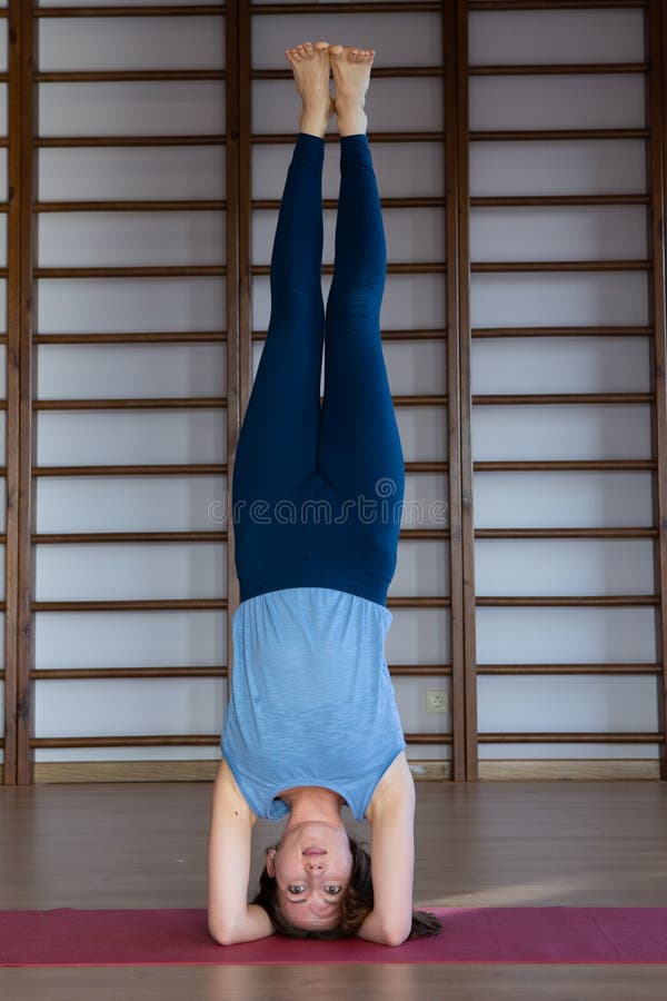 Premium Photo | Little girl posing while standing in bridge pose at home  stretching in yoga beauty and health at home