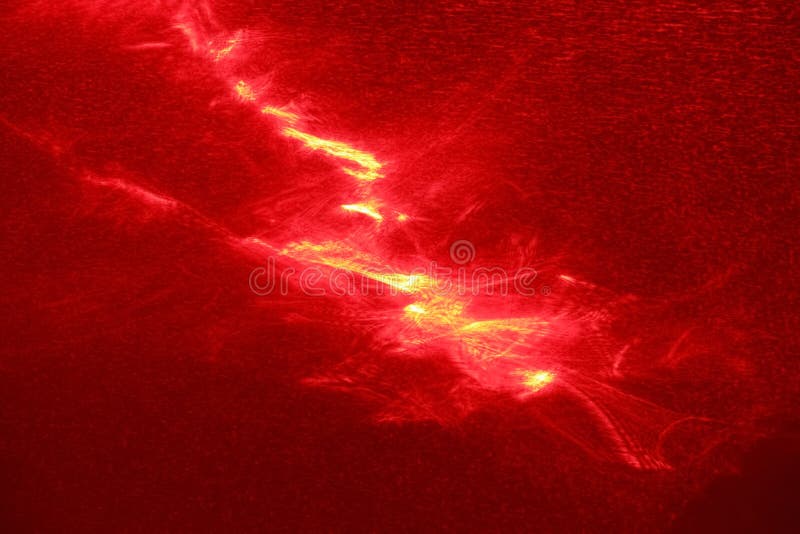 Abstract photophone painted with a red laser as a result of light refraction. Place for text